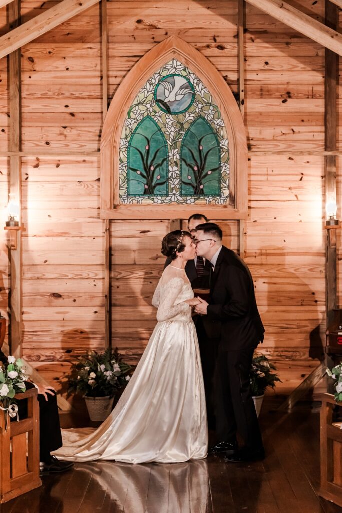 First kiss in Mary's Chapel at Selby Gardens by Amanda Dawn Photography