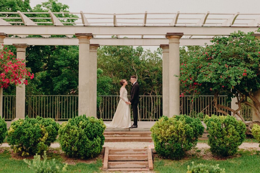a bride and groom at the marie selby botanical gardens wedding venue at historic spanish point in sarasota, florida.