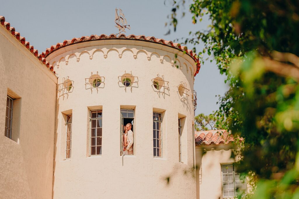 Couple kissing in the Ship Room Tower at the Powel Crosley Estate.