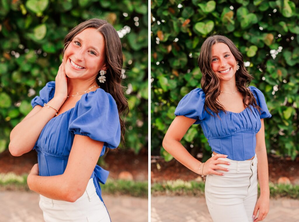 Senior posing in front of sea grapes in Madeira beach wearing a bright blue top and white pants. 